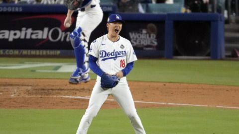 Los Angeles Dodgers starting pitcher Yoshinobu Yamamoto (18) reacts after striking out New York Yankees' Anthony Rizzo during the fourth inning in Game 2 of the baseball World Series, Saturday, Oct. 26, 2024, in Los Angeles. (AP Photo/Julio Cortez)