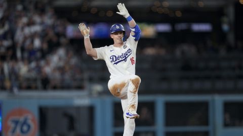 Los Angeles Dodgers' Will Smith celebrates a double against the New York Yankees during the fourth inning in Game 2 of the baseball World Series, Saturday, Oct. 26, 2024, in Los Angeles. (AP Photo/Ashley Landis)