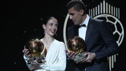 Barcelona's Spanish player Aitana Bonmati, left, and Manchester City's Spanish player Rodri hold their 2024 Ballon d'Or trophies during the 68th Ballon d'Or (Golden Ball) award ceremony at Theatre du Chatelet in Paris, Monday, Oct. 28, 2024. (AP Photo/Michel Euler)