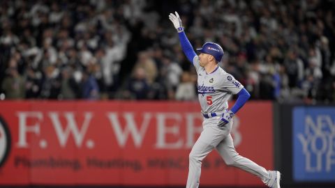 Los Angeles Dodgers' Freddie Freeman celebrates a two-run home run against the New York Yankees during the first inning in Game 3 of the baseball World Series, Monday, Oct. 28, 2024, in New York. (AP Photo/Ashley Landis)