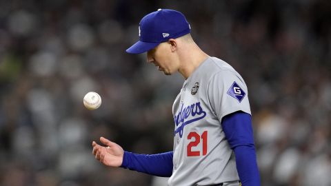 Los Angeles Dodgers starting pitcher Walker Buehler tosses the ball after walking New York Yankees' Gleyber Torres during the first inning in Game 3 of the baseball World Series, Monday, Oct. 28, 2024, in New York. (AP Photo/Godofredo A. Vásquez)