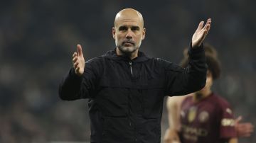 Manchester City's head coach Pep Guardiola reacts at the end of the English League Cup fourth round soccer match between Tottenham and Manchester City, at the Tottenham Hotspur Stadium in London, Wednesday, Oct 30, 2024. (AP Photo/Ian Walton)