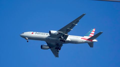 FILE - An American Airlines Boeing 777 is framed by utility wires as it prepares to land at Miami International Airport, Wednesday, Jan. 27, 2021, in Miami. An American Airlines flight landed safely in Los Angeles on Wednesday, March 13, 2024, after the flight crew reported a potential mechanical issue with the plane. (AP Photo/Wilfredo Lee, File)