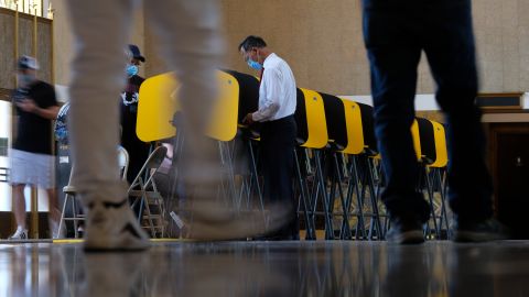 Voters cast their ballots for the California gubernatorial recall election at a vote center set up in Los Angeles Union Station, Tuesday, Sept. 14, 2021, in Los Angeles. (AP Photo/Ringo H.W. Chiu)