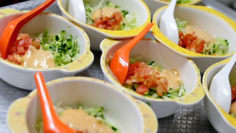 Bowls of salad are ready to be served, Tuesday, May 6, 2014 at Delcare Edu Center, a local kindergarten and child care center in the business district of Singapore. Everyday, lunch is prepared by the school's kitchen staff, who take great care to promote healthy eating in the selection of their ingredients and methods of food preparation. The children in this school are also taught to accept a wide variety of food and a weekly menu is prepared by the principal each school term. Healthy snacks consisting of fruits, home-made bread, natural beans, soup and barley are served between meals. (AP Photo/Wong Maye-E)