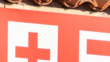An unidentified patient receives oxygen on a stretcher, while Los Angeles Fire Department Paramedics monitor him outside the Emergency entrance, waiting for admission at the CHA Hollywood Presbyterian Medical Center in Los Angeles Friday, Dec. 18, 2020. Increasingly desperate California hospitals are being "crushed" by soaring coronavirus infections, with one Los Angeles emergency doctor predicting that rationing of care is imminent. (AP Photo/Damian Dovarganes)
