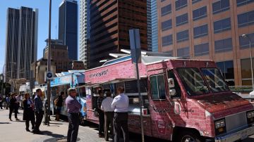 A food truck offering middle eastern food is parked by an office building on a street in downtown Los Angeles on Thursday, March 5, 2015. Mountainside hikes along urban cityscapes. Ramen noodle bars, Korean tea houses and taco trucks serving every regional Mexican specialty. Los Angeles is known for classic Hollywood, but these days the city is getting attention for other attractions too. (AP Photo/Richard Vogel)