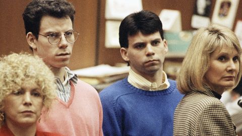 Lyle Menendez, right, and brother Erik listen to a charge of murder conspiracy against them with Leslie Abramson, far left, attorney for Erik, Dec. 29, 1992 in Los Angeles. The brothers pled innocent to the new indictment which dropped the original charge that they killed their parents for money. The indictment was returned nearly three years after Joseph and Kitty Menendez were found slain in their home. (AP Photo/Chris Martinez)