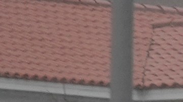A boat damaged in Hurricane Helene rests against a bridge ahead of the arrival of Hurricane Milton, in South Pasadena, Fla., Wednesday, Oct. 9, 2024. (AP Photo/Rebecca Blackwell)