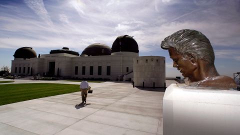 FILE- This Oct. 3, 2006 file photo shows a statue of actor James Dean at the newly renovated Griffith Observatory on Mount Hollywood in Los Angeles. The observatory will reopen its doors to the public Nov. 3, after a comprehensive $93 million renovation and expansion project. (AP Photo/Damian Dovarganes, File)