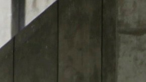 FILE - In this Sept. 28, 2011 photo, people walk past the Los Angeles County Sheriff's Men's Central Jail facility in Los Angeles. A federal judge has given initial approval to an agreement that requires the Los Angeles County Sheriffs Department to improve conditions in its jails for inmates using wheelchairs and others with mobility impairments. (AP Photo/Damian Dovarganes, File)