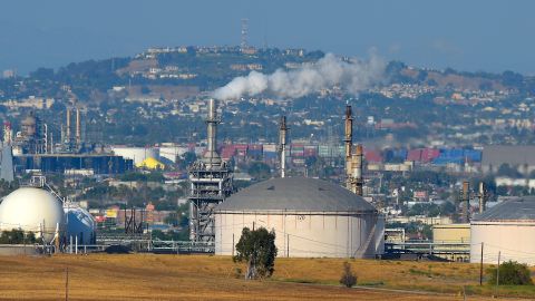 FILE - This July 16, 2014 file photo shows the Phillips 66 refinery in the Wilmington area of Los Angeles. The Commerce Department reports on the U.S. trade deficit in July. The report will be released Thursday, Sept. 4, 2014. The nation's trade balance in oil has continued to improve this year. The U.S. had a petroleum trade deficit of $105.3 billion in the first half of this year, down from $125.7 billion last year. (AP Photo/Mark J. Terrill)