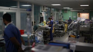 FILE - In this Sept.10, 2020, file photo, medical workers prepare equipment in a COVID-19 area in a Marseille hospital, southern France. Intensive care wards across France are filling up again with COVID-19 patients. Doctors are scrambling to create new ICU beds elsewhere to accommodate the sick, and asking what went wrong. (AP Photo/Daniel Cole, File)