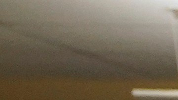 FILE - Election worker Donna Young inspects a mail-in ballot for damage at the Sacramento County Registrar of Voters in Sacramento, Calif., June 3, 2022. (AP Photo/Rich Pedroncelli, File)