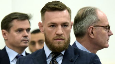 Mixed martial arts fighter Conor McGregor, center, arrives at Brooklyn Supreme Court, Thursday, June 14, 2018, in New York. McGregor expressed regret on Thursday for a backstage melee at a Brooklyn arena, and is in plea negotiations to resolve charges in the case. (Rashid Umar Abbasi /New York Post via AP, Pool)