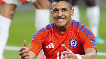 Chile's Alexis Sanchez reacts during a Copa America Group A soccer match against Peru in Arlington, Texas, Friday, June 21, 2024. (AP Photo/Julio Cortez)