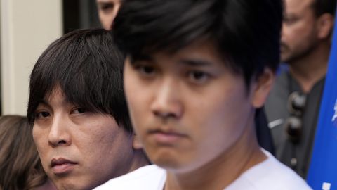 FILE - Ippei Mizuhara, left, stands next to Los Angeles Dodgers baseball player Shohei Ohtani , right, and translates during an interview at Dodger Stadium, Feb. 3, 2024. A Southern California bookmaker who took thousands of sports bets from Mizuhara, the ex-interpreter for Ohtani, has agreed to plead guilty to running an illegal gambling business, U.S. authorities announced Thursday, Aug. 1, 2024. (AP Photo/Richard Vogel, File)