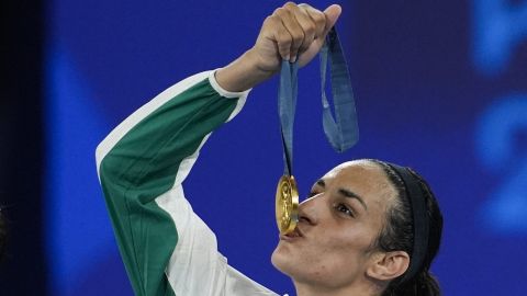 FILE - Gold medalist Algeria's Imane Khelif kisses her medal for the women's 66 kg final boxing match at the 2024 Summer Olympics, Friday, Aug. 9, 2024, in Paris, France. (AP Photo/John Locher, File)