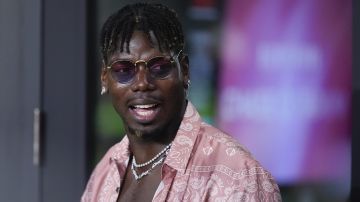 French professional soccer player Paul Pogba stands in a VIP suite at the start of an MLS soccer match between Inter Miami and Charlotte FC, Saturday, Sept. 28, 2024, in Fort Lauderdale, Fla. (AP Photo/Rebecca Blackwell)