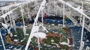 The roof of the Tropicana Field is damaged the morning after Hurricane Milton hit the region, Thursday, Oct. 10, 2024, in St. Petersburg, Fla. (AP Photo/Julio Cortez)