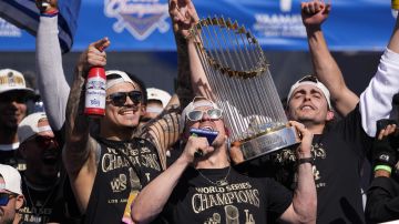 Los Angeles Dodgers' Kiké Hernández celebrates with teammates on the stage during the baseball team's World Series championship parade and celebration at Dodger Stadium, Friday, Nov. 1, 2024, in Los Angeles. (AP Photo/Mark J. Terrill)