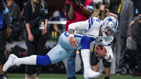 Dallas Cowboys quarterback Dak Prescott (4) runs out of bounds during the first half of an NFL football game against the Atlanta Falcons, Sunday, Nov. 3, 2024, in Atlanta. The Falcons defeated the Cowboys 27-21. (AP Photo/Danny Karnik)