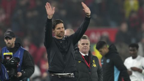 Leverkusen's head coach Xabi Alonso waves to the crowd at the end of the Champions League opening phase soccer match between Liverpool and Bayer Leverkusen at Anfield in Liverpool, England, Tuesday, Nov. 5, 2024. (AP Photo/Jon Super)