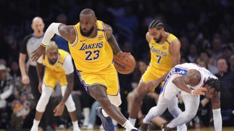 Los Angeles Lakers forward LeBron James, second from right, drives with the ball after stealing it from Philadelphia 76ers guard Ricky Council IV, right, during the first half of an NBA basketball game, Friday, Nov. 8, 2024, in Los Angeles. (AP Photo/Mark J. Terrill)