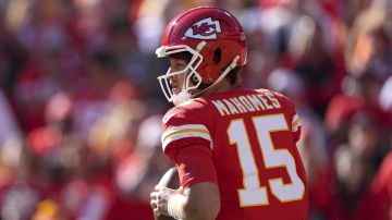 Kansas City Chiefs quarterback Patrick Mahomes looks to pass during the first half of an NFL football game against the Denver Broncos Sunday, Nov. 10, 2024, in Kansas City, Mo. (AP Photo/Charlie Riedel)