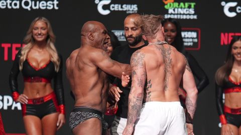 Mike Tyson, left, slaps Jake Paul during a weigh-in ahead of their heavyweight bout, Thursday, Nov. 14, 2024, in Irving, Texas. (AP Photo/Julio Cortez)