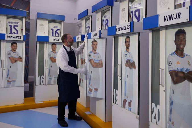 The Real Madrid first-team changing room lockers from Santiago Bernabeu Stadium are displayed at Sotheby's auction rooms in London, Wednesday, Nov. 20, 2024. The sale features 24 individual lockers previously used by footballers including Cristiano Ronaldo, David Beckham and Zinedine Zidane. (AP Photo/Kin Cheung)