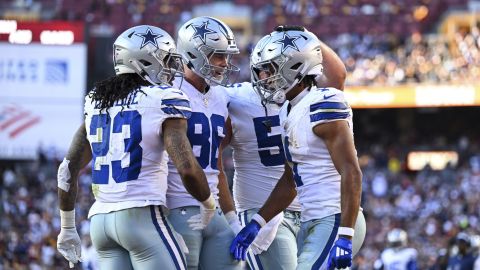 Dallas Cowboys wide receiver Jalen Tolbert, right, celebrates his touchdown reception with teammates during the first half of an NFL football game against the Washington Commanders, Sunday, Nov. 24, 2024, in Landover, Md. (AP Photo/Terrance Williams)