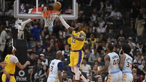 Los Angeles Lakers' LeBron James (23) goes to the basket during the second half of an NBA basketball game against the San Antonio Spurs, Wednesday, Nov. 27, 2024, in San Antonio. (AP Photo/Darren Abate)