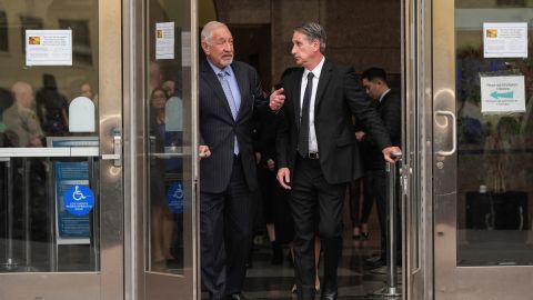 Mark Geragos, left, and Bryan Freedman, attorneys for Erik and Lyle Menendez, and their family members leave a courthouse after a hearing in Los Angeles, Monday, Nov. 25, 2024. (AP Photo/Jae C. Hong)