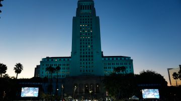 City Hall is lit in blue before the Los Angeles Dodgers baseball World Series championship parade Friday, Nov. 1, 2024, in Los Angeles. (AP Photo/Damian Dovarganes)