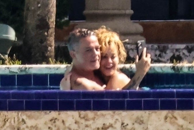 Photo © 2024 Backgrid/The Grosby Group PREMIUM EXCLUSIVE Miami, FL - 31 OCTOBER 2024 Spanish singer and composer Alejandro Sanz and his bikini-clad girlfriend Candela Marquez are spotted packing on the PDA while enjoying a sun soaked day by the pool in Miami.**** Alejandro Sanz y su novia Candela Márquez en bikini son vistos desplegando sus afectos mientras disfrutan de un día soleado junto a la piscina en Miami.