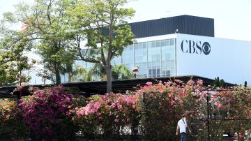 A pedestrian walks by the CBS Television City studios, Friday, July 3, 2020, in Los Angeles. (AP Photo/Chris Pizzello)