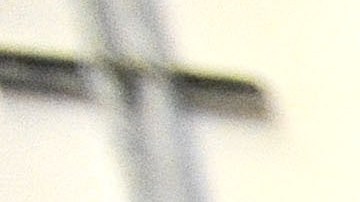 FILE - In this Nov. 14, 2013 file photo, a corrections officer stands near a gate at Baltimore City Detention Center in Baltimore. Inside the Baltimore City Detention Center, gang members used smuggled cellphones, dealt drugs and had sex with corrupt guards  several of whom they impregnated  who helped them as they ran operations of the Black Guerilla Family, according to court papers in a case alleging widespread corruption at the state-run facility. (AP Photo/Steve Ruark, FIle)