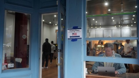 Voters cast ballots, at left, as customers dine at La Boulangerie in San Francisco, Tuesday, Nov. 5, 2024. (AP Photo/Jeff Chiu)