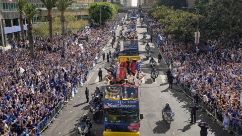 Los Angeles Dodgers players, coaches and ownership group are paraded on buses during the baseball team's World Series championship parade Friday, Nov. 1, 2024, in Los Angeles. (AP Photo/Damian Dovarganes)