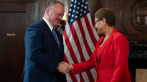 Los Angeles Mayor Karen Bass, right, and newly appointed police chief Jim McDonnell shake hands during a news conference in Los Angeles, Friday, Oct. 4, 2024. (AP Photo/Jae C. Hong)