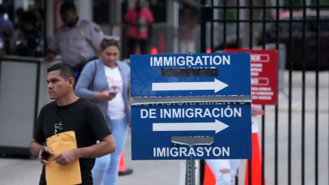 People leave the Immigration and Customs Enforcement (ICE) offices, Wednesday, July 26, 2023, in Miramar, Fla. (AP Photo/Wilfredo Lee)