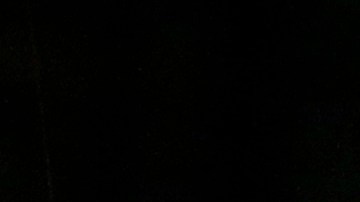 A California Highway Patrol officer sits in his car Thursday, Dec. 3, 2015, near the scene where a police shootout with suspects took place on Wednesday, in San Bernardino, Calif. A heavily armed man and woman opened fire Wednesday on a holiday banquet for his co-workers, killing multiple people and seriously wounding others in a precision assault, authorities said. Hours later, they died in the shootout with police. (AP Photo/Jae C. Hong)