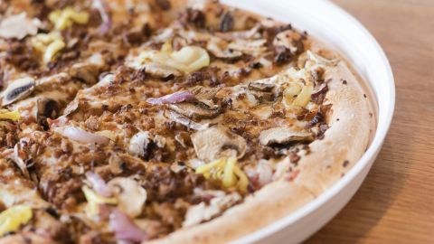 IMAGE DISTRIBUTED FOR PIZZA HUT - The new Garden Specialty Pizza, a pizza with Incogmeato a plant-based Italian sausage topping at Pizza Hut at 3602 E Thomas on Wednesday October 23, 2019. Pizza Hut is testing a round box and plant-based topping at one store in Phoenix. The round box is one of the most innovative pizza packaging designs on the market. (Mark Peterman/AP Images for Pizza Hut)