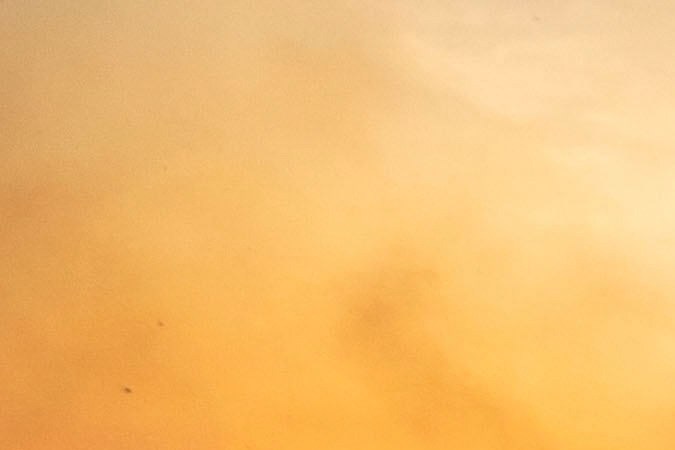 A firefighter, moves bicycles as he works against the Mountain fire, Wednesday, Nov. 6, 2024, near Camarillo, Calif. (AP Photo/Ethan Swope)