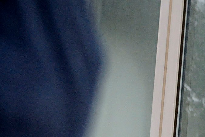 A Los Angeles County sheriff's deputy maintains a perimeter around the Van Nuys courthouse for the hearing for Erik and Lyle Menendez in Los Angeles, Monday, Nov. 25, 2024. (AP Photo/Damian Dovarganes)