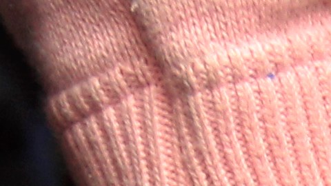 An unidentified female Colombian suspect in handcuffs is presented to the press after her Monday arrest in connection with seized cocaine at a police base in Lima, Peru, Wednesday Aug. 17, 2011. According to police, about one ton of cocaine was seized during two operations, on Aug. 11 and Aug. 15 in Lima and in the northern province of Paita, and four Colombians were arrested. (AP Photo/Martin Mejia)