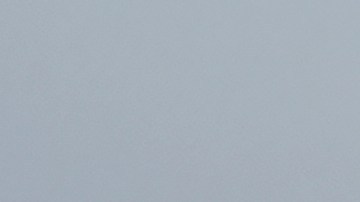 A pedestrian carrying an umbrella walks in front of the Golden Gate Bridge in San Francisco, Wednesday, Nov. 20, 2024. (AP Photo/Jeff Chiu)