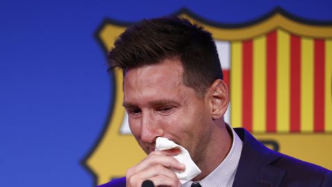 FILE - In this Sunday, Aug. 8, 2021 file photo, Lionel Messi cries at the start of a press conference at the Camp Nou stadium in Barcelona, Spain. A person with knowledge of the negotiations on Tuesday, Aug. 10 says Lionel Messi is traveling to France after agreeing to join Paris Saint-Germain. The person says the 34-year-old Argentina star is set to agree a two-year contract with the option for a further season (AP Photo/Joan Monfort, file)