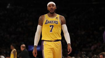 Los Angeles Lakers forward Carmelo Anthony (7) walks on the court against the New York Knicks during the first half of an NBA basketball game on Tuesday, Nov. 23, 2021, in New York. (AP Photo/Jim McIsaac)